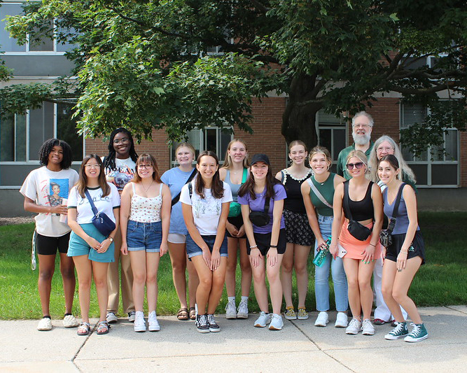 A group of students and donors stand outside for a photo. Briggs Summer Scholars from 2023