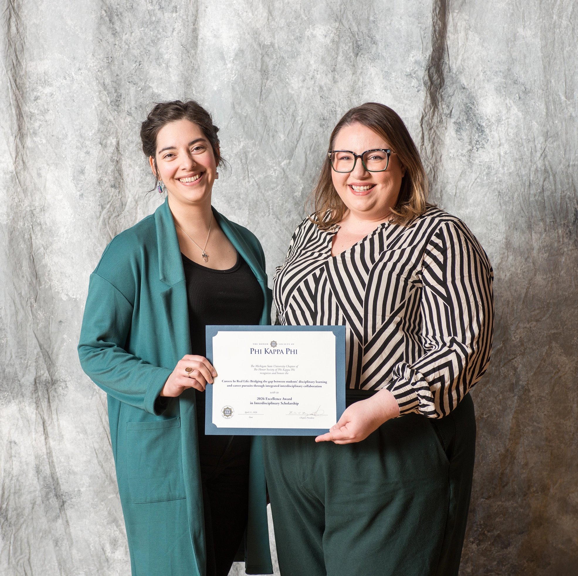 Graduate fellow Marinna Guzy and LBC Assoc. Director of Career Services Krysta Foster with the PKP award